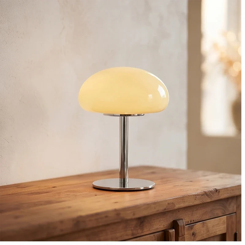 Cream glass lamp styled in a warm home setting