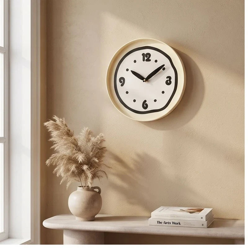 Black clock styled in a warm home setting