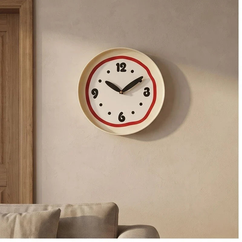 Red clock styled in a warm home setting