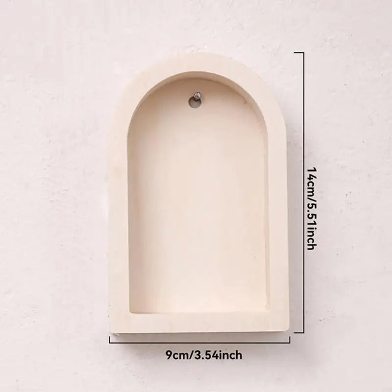 An arched recessed shelf or niche shown against a light textured wall, with dimension labels indicating 14cm/5.51inch height and 9cm/3.