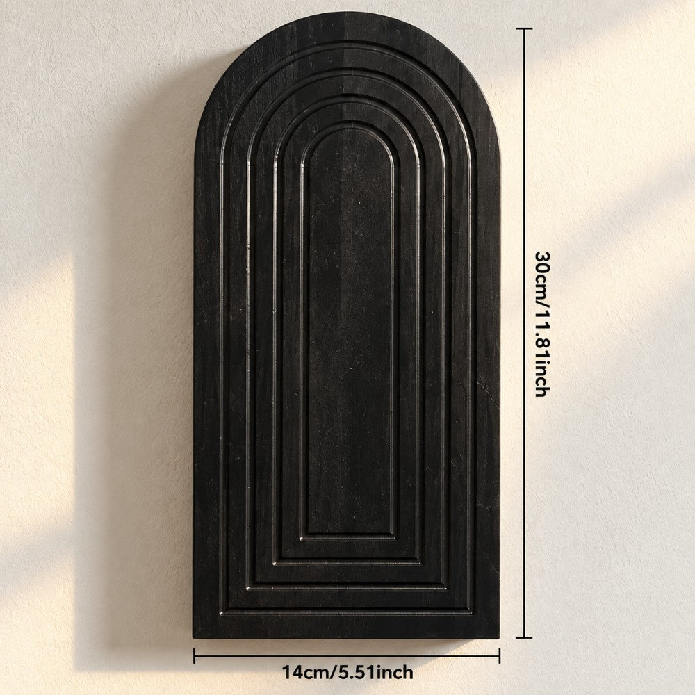 A black arched decorative wall hook or plaque with raised concentric panel lines, shown against a light wall with dimension annotations reading 30cm/11.8 inches tall and 14cm/5.